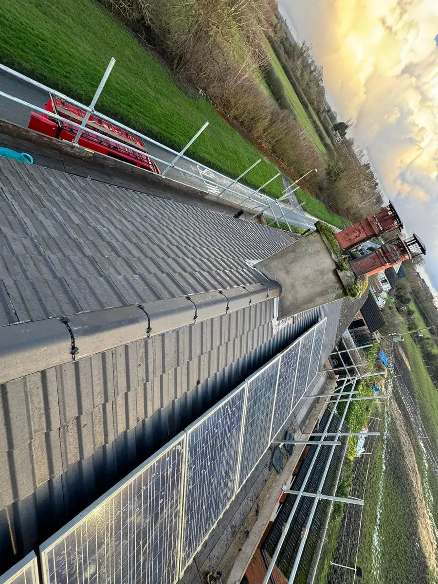 Battens fixed over membrane on a hipped roof, seen from above the scaffold