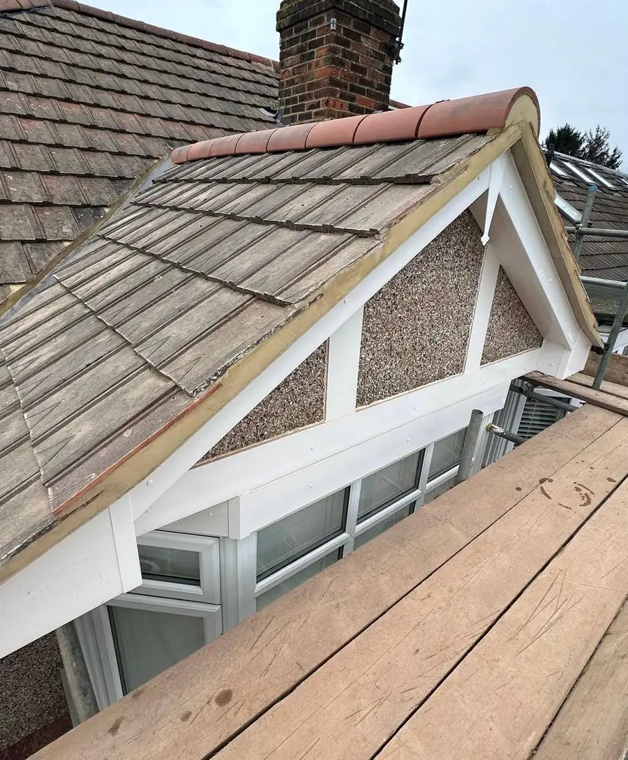 The same dormer re-tiled with a new ridge and white fascia
