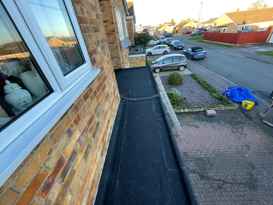 Torch-on felt flat roof on a garage, seen from an upstairs window