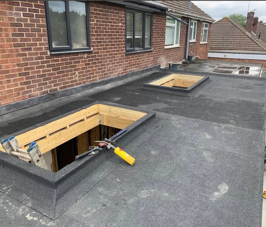 Felt flat roof with a skylight on a bungalow extension