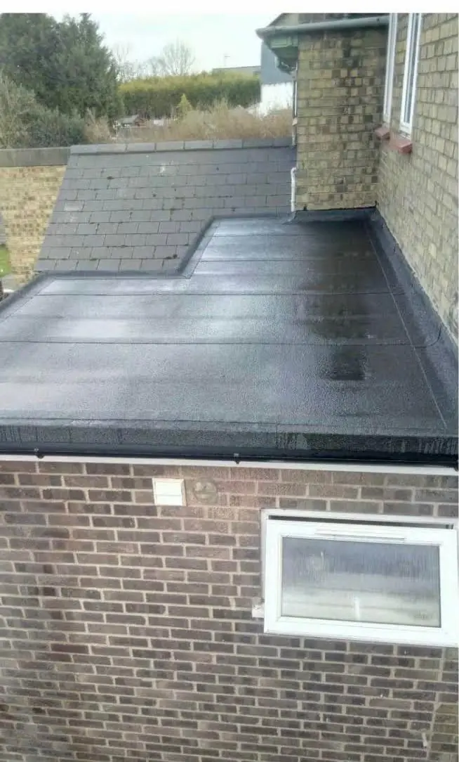 After: new torch-on felt flat roof on the same extension