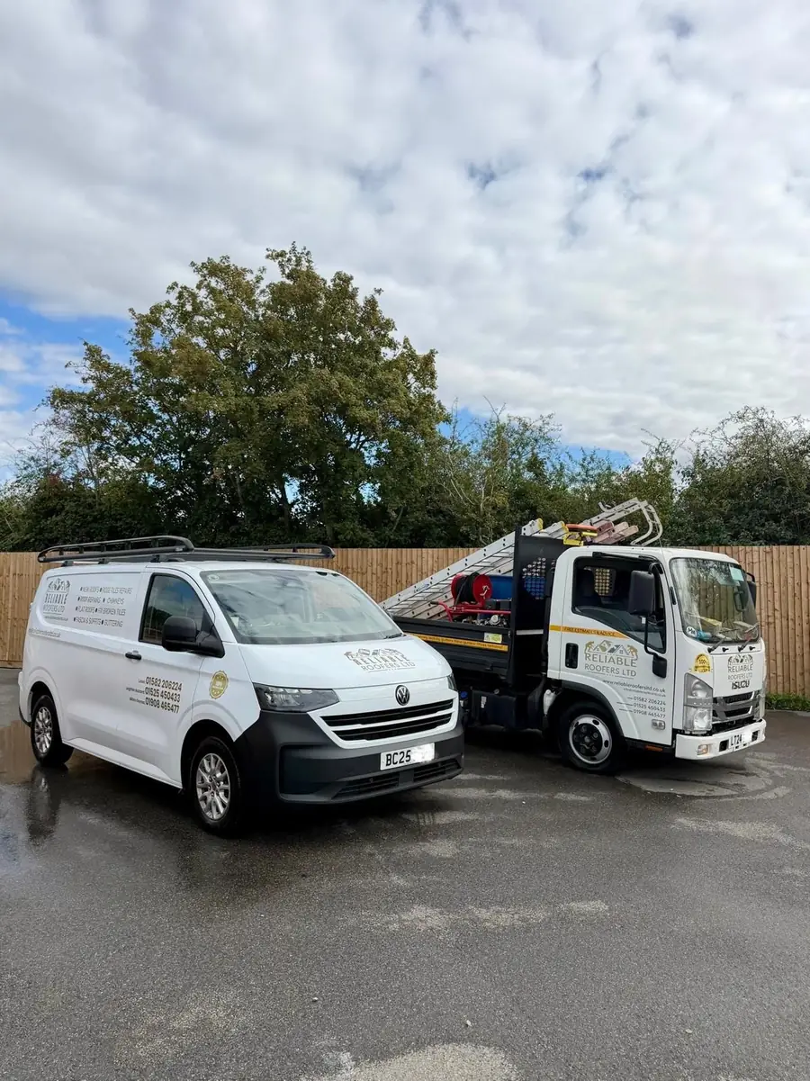 Reliable Roofers Ltd van and tipper truck, sign-written, ready for a strip and re-roof
